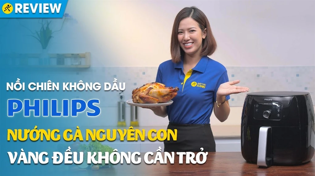 Nồi chiên không dầu Philips Airfryer XXL HD9650/90 cùng món gà nguyên con đã được nướng vàng đều, không cần trộn, thể hiện tính năng nấu ăn tiện lợi và tiết kiệm dầu mỡ.